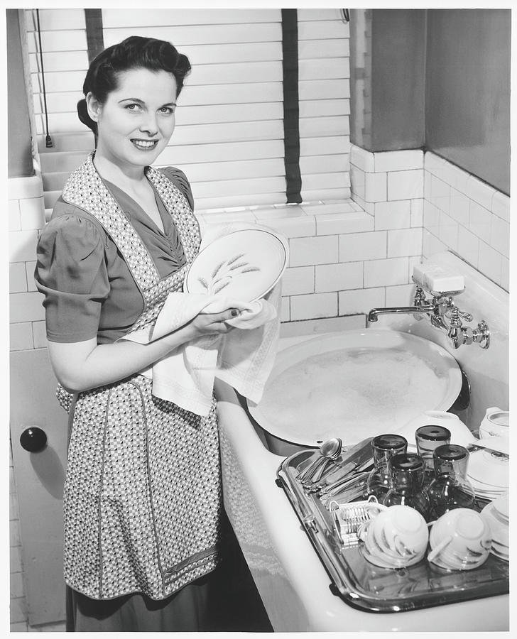 woman-drying-dishes-at-kitchen-sink-george-marks